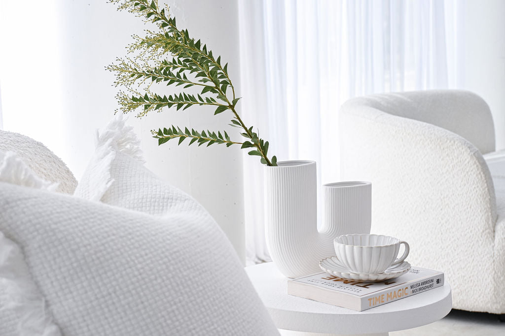 White decor with a coffee table and a white Jug